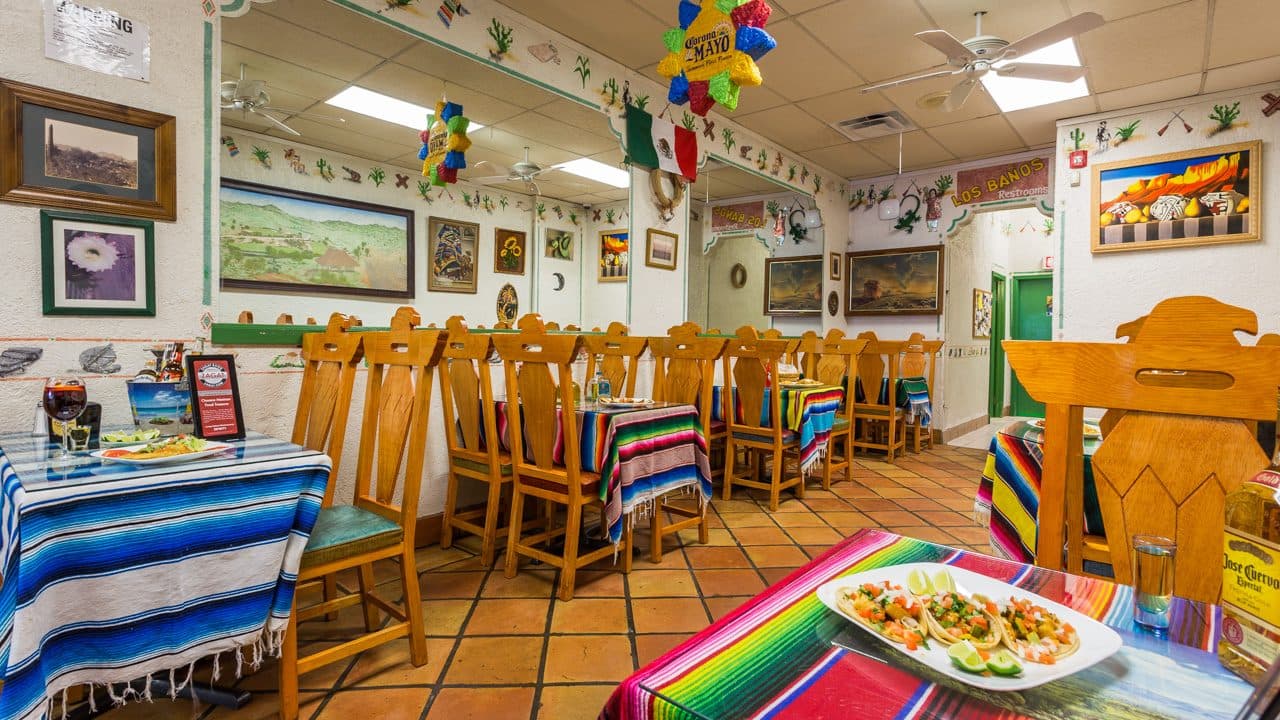 Dining room decorated with Mexican flags and folk art