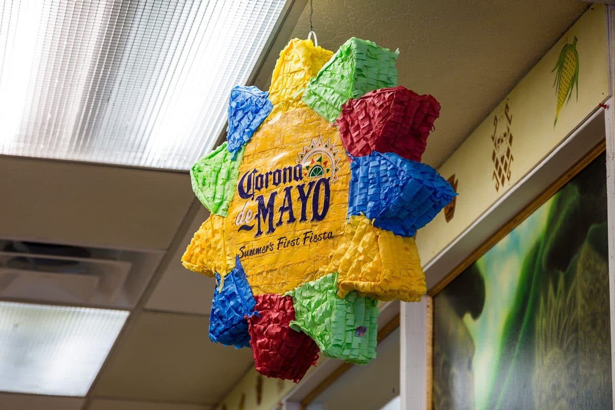 A paper piñata hanging in the dining room